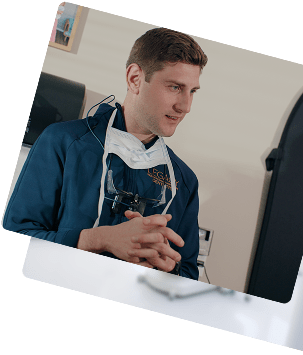 Prosthodontic care at Legacy Prosthodontics: A featured image of Dr. Lazaroff in a professional setting, featuring a close-up of the doctor and a background shot of the clinical office at Legacy Prosthodontics.